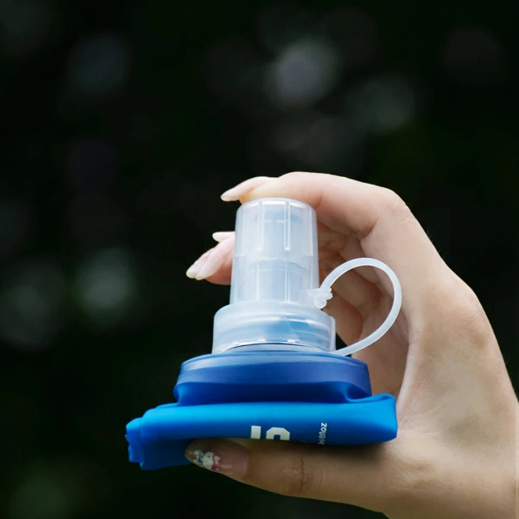 Hand holding a blue and clear silicone sleeve with text about portability and sports use.