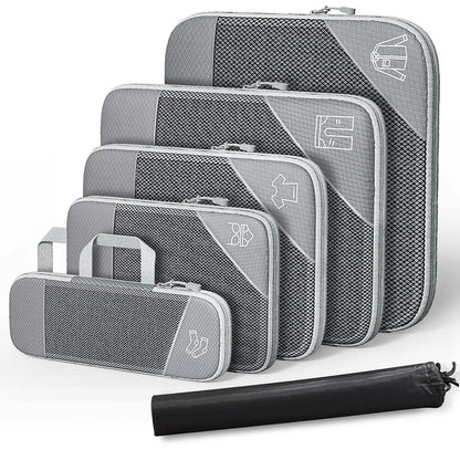 Set of gray packing cubes with a black compression bag on a white background