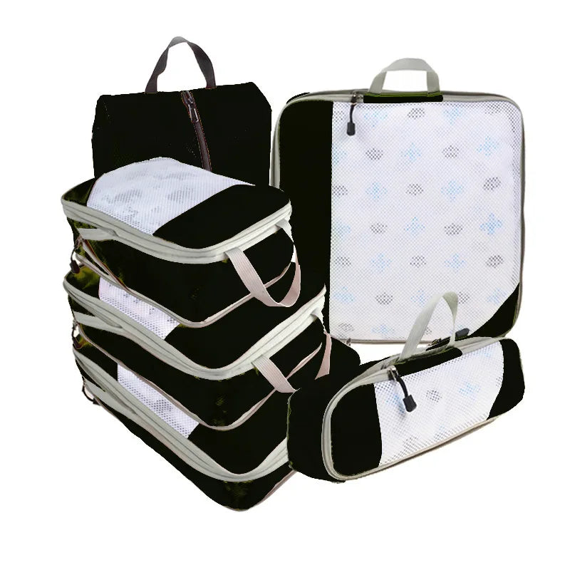Set of black and white packing cubes on a white background
