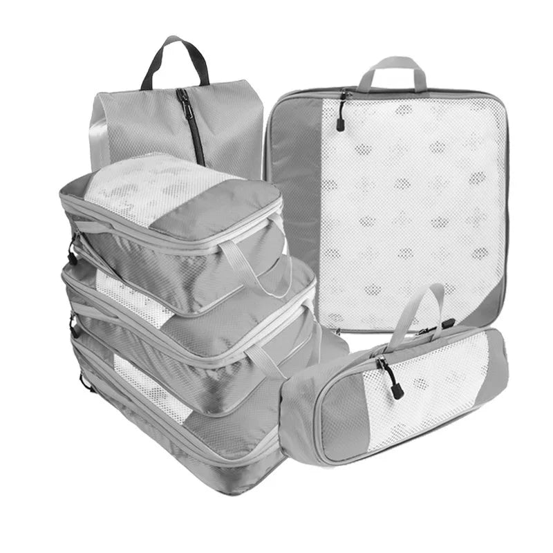 Set of gray packing cubes and backpack on a white background