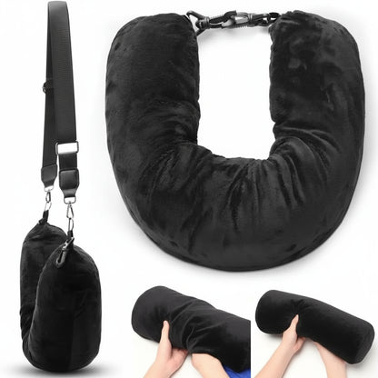 Black travel neck pillow with carrying strap on a white background