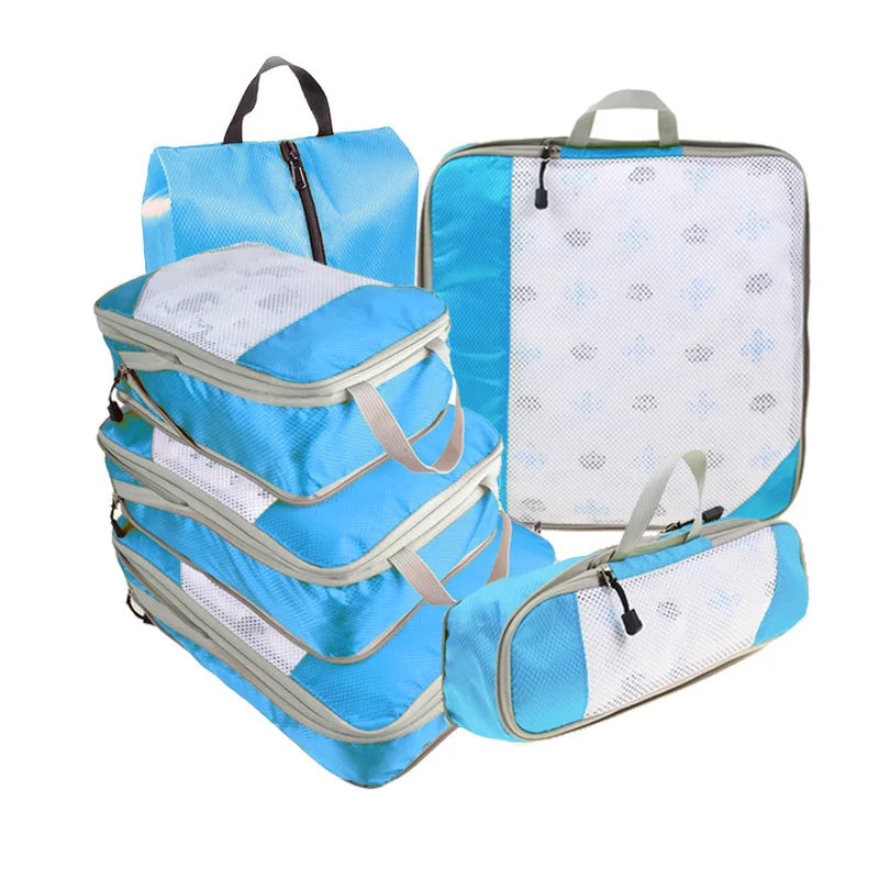 Set of blue packing cubes with white interior on a white background