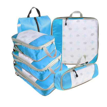Set of blue packing cubes with white interior on a white background