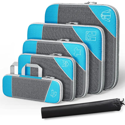 Set of blue and gray packing cubes with a black rolling bag on a white background