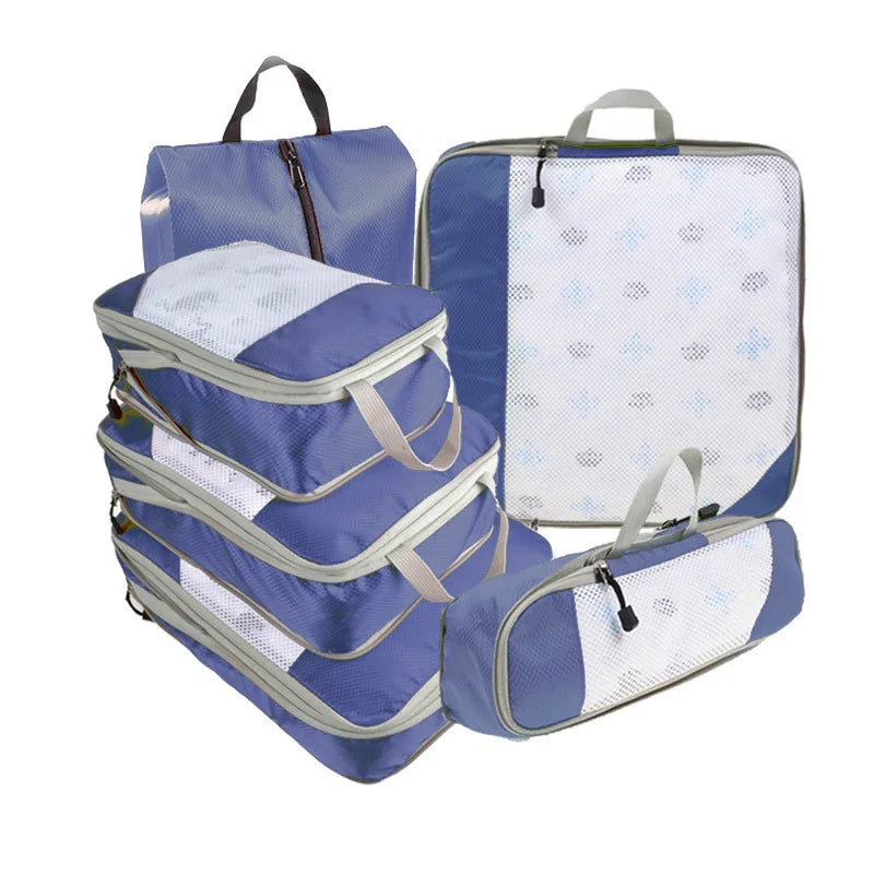 Set of blue and white packing cubes on a white background