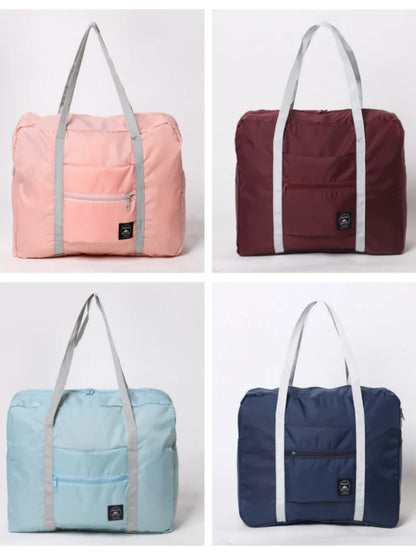 Four different colored bags (pink, maroon, blue, navy) on a light gray background