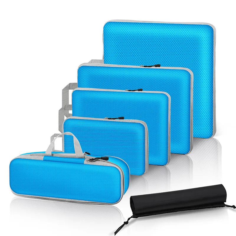 Set of blue travel bags with varying sizes on a white background