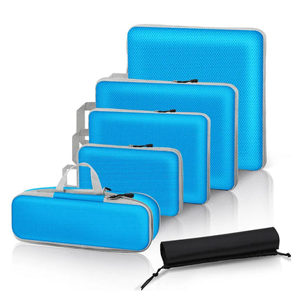 Set of blue travel bags with varying sizes on a white background